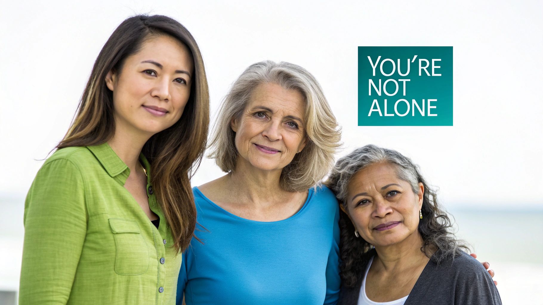 Three diverse women of different ages smiling with a "YOU'RE NOT ALONE" message.