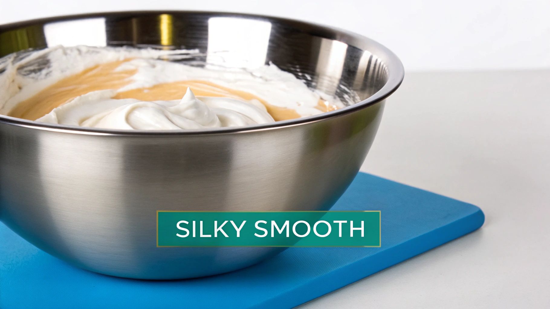 A white bottle of lotion next to a small bowl of the same lotion, with a green leaf for decoration, on a neutral background.