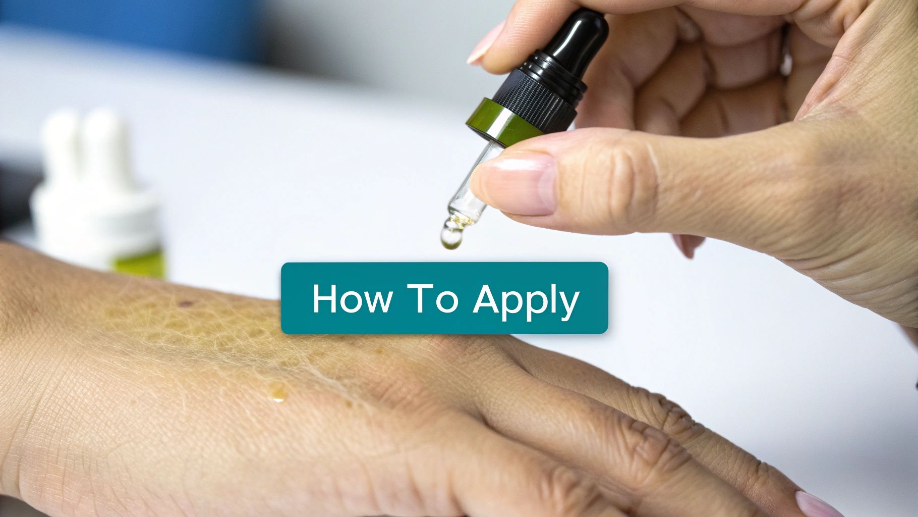 A hand holds a dropper applying oil drops to another hand with textured skin, demonstrating application.