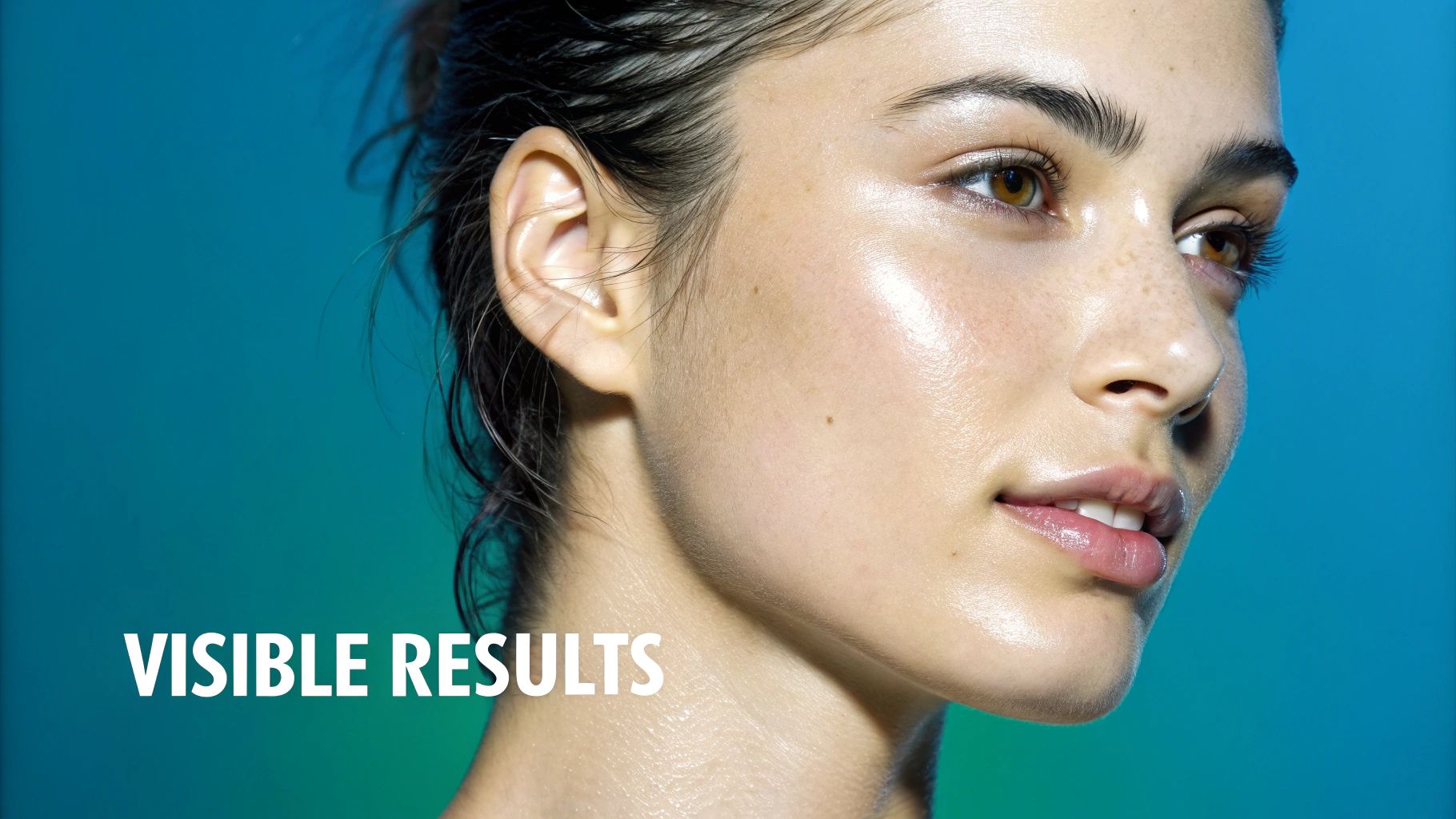 Close-up of a woman with dewy, glowing skin and wet hair, showcasing visible skincare results.
