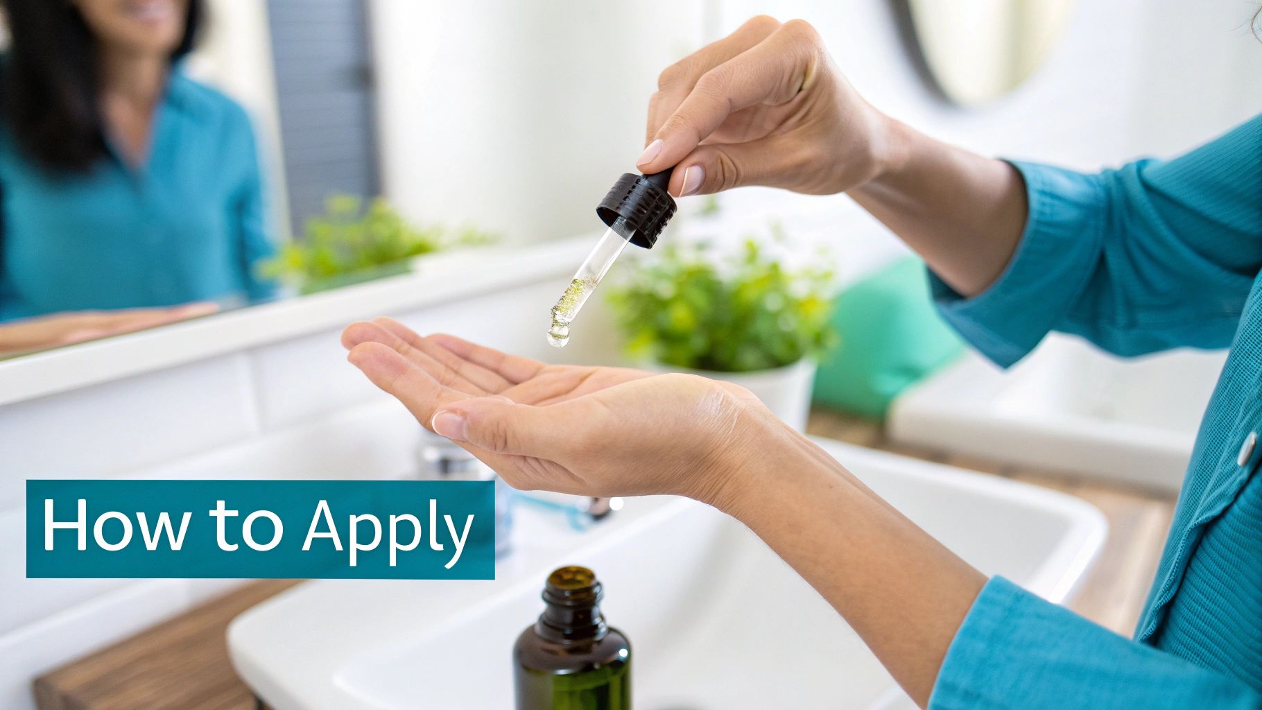 A person's hands dispense a few drops of yellowish serum from a dropper into their palm in a bathroom.