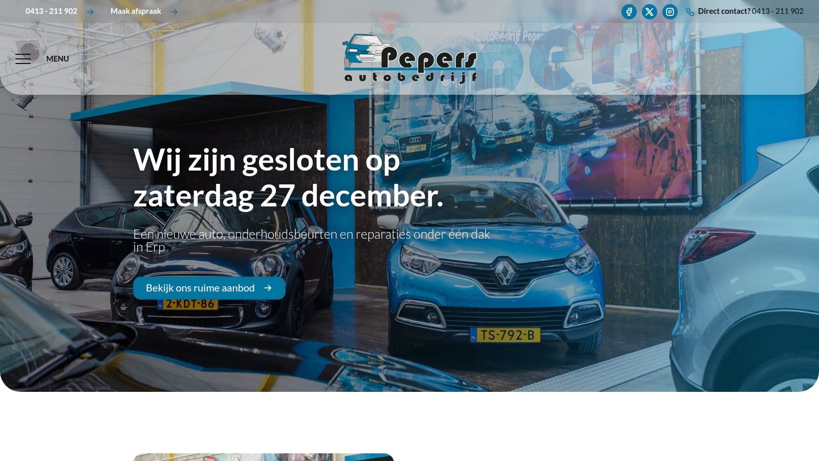 A view of the Autobedrijf Pepers showroom and workshop in Erp, showcasing several cars for sale.