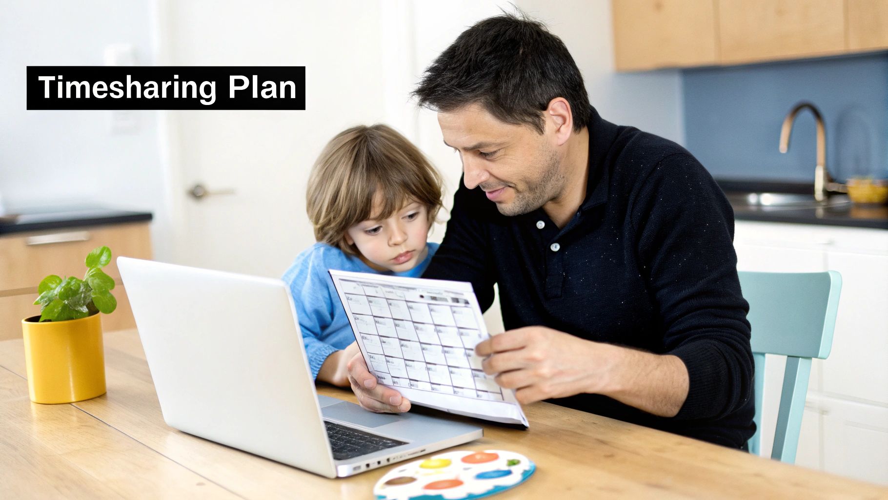 A father and son review a timesharing plan schedule at a kitchen table with a laptop.