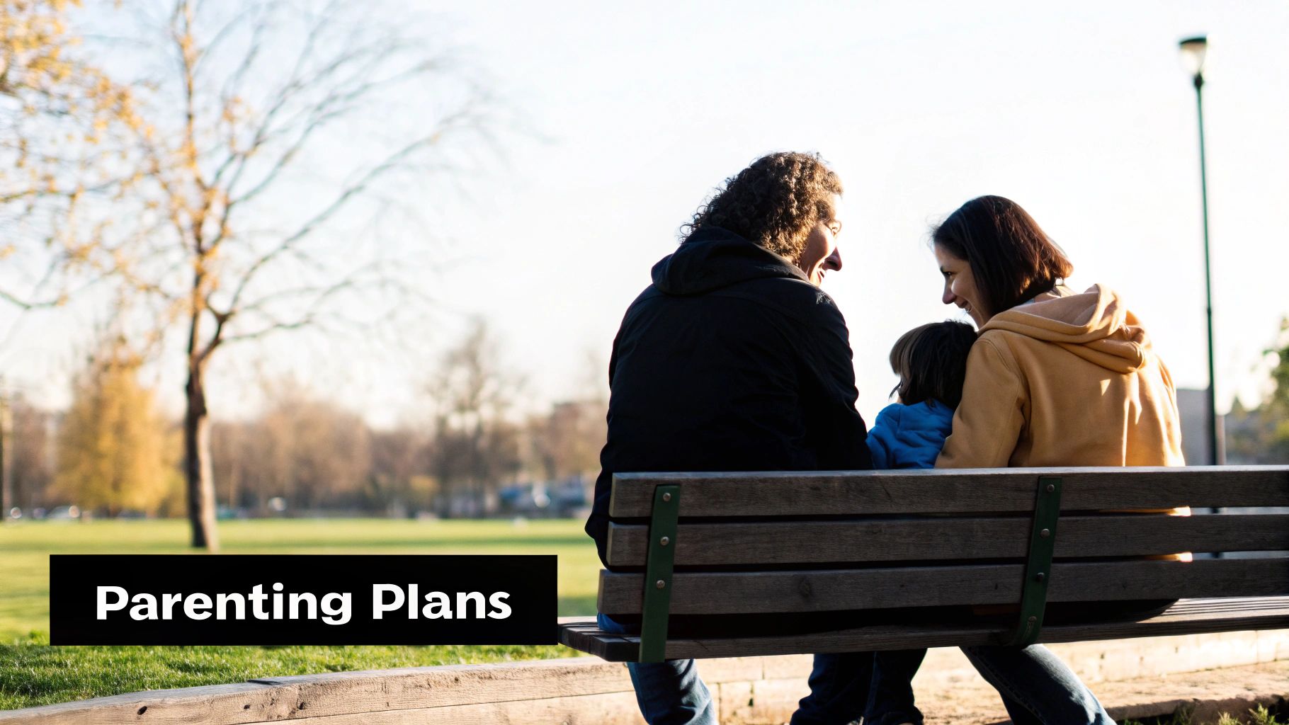Two adults and a child smiling on a park bench, with 'Parenting Plans' text overlay.