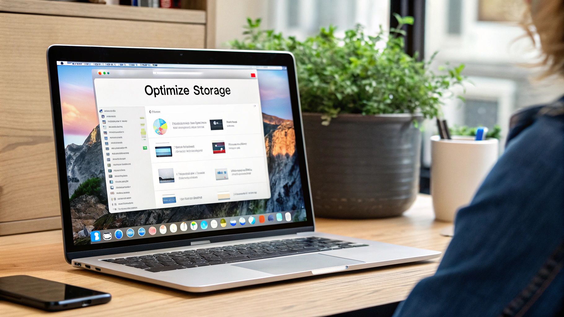A person working on a Mac at a clean, organized desk, symbolizing good digital habits.