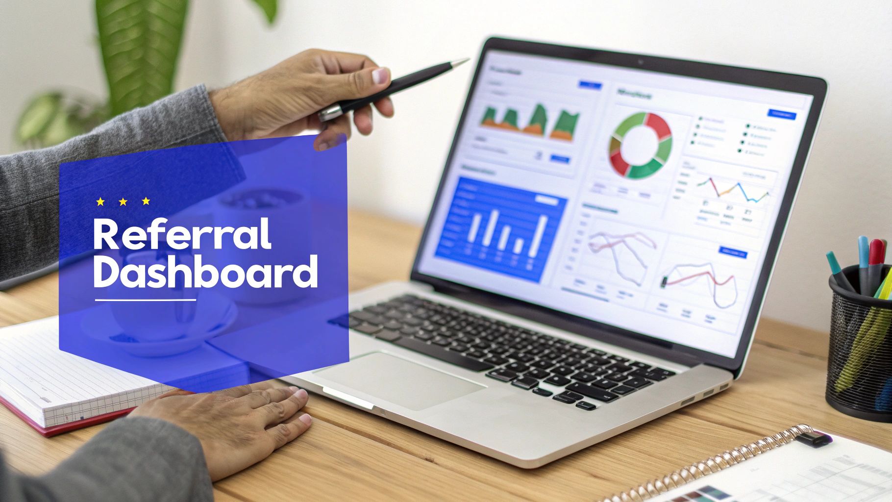 A person uses a laptop displaying a referral program dashboard with charts and graphs.