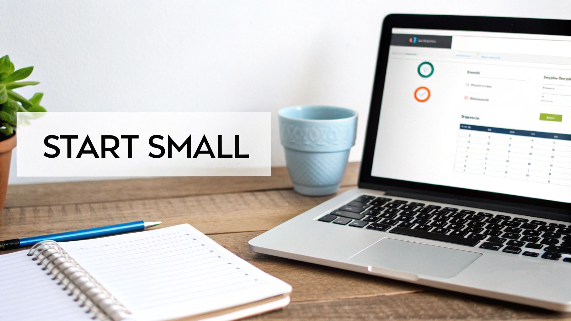 A wooden desk setup with a laptop, open notebook, pen, mug, and plant, plus text 'START SMALL'.
