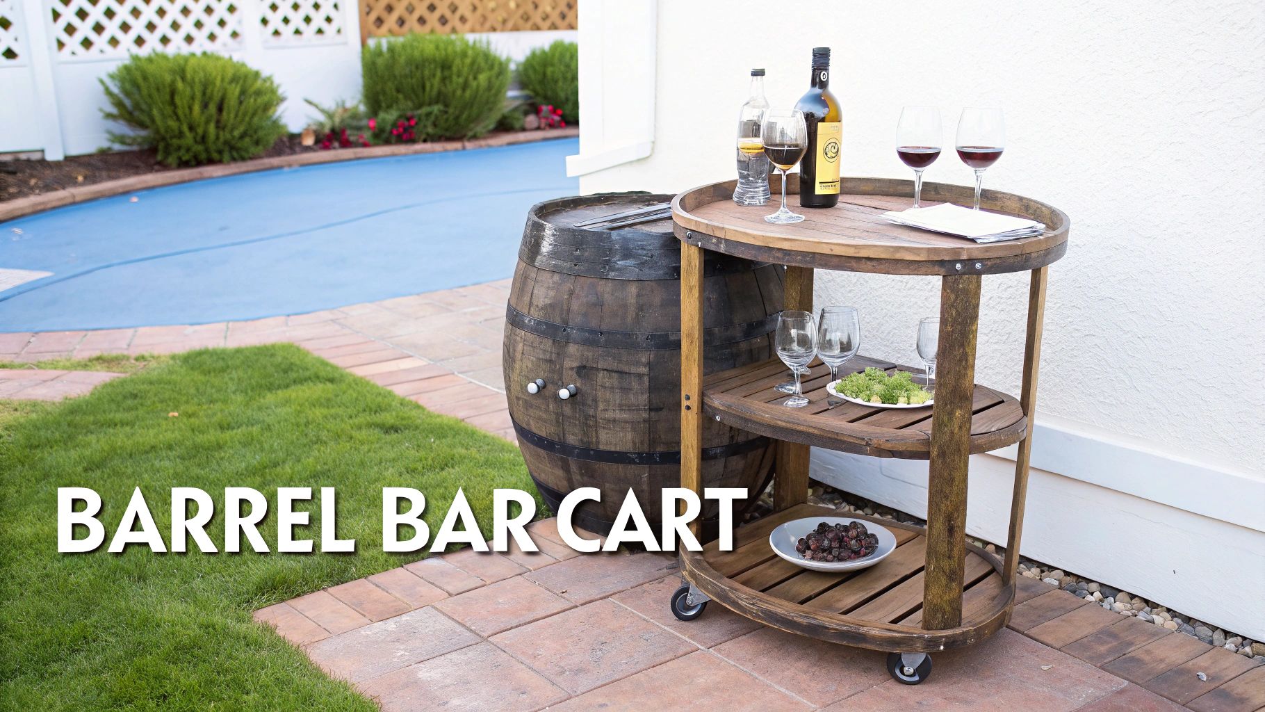 A rustic wooden barrel bar cart on wheels with wine bottles and glasses in a backyard patio setting.