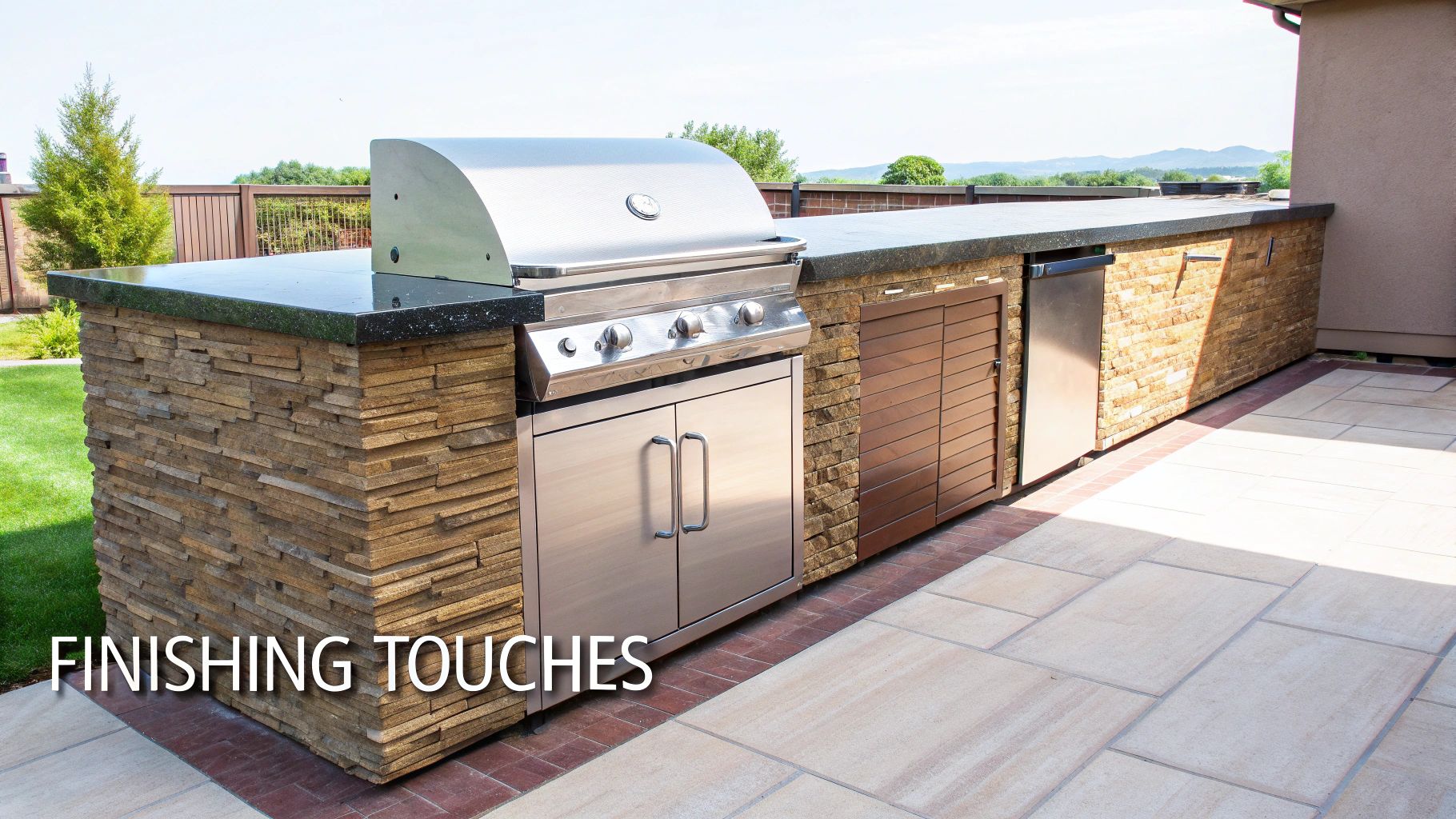 An outdoor kitchen island with a built-in grill, storage, and a mini-fridge on a patio.