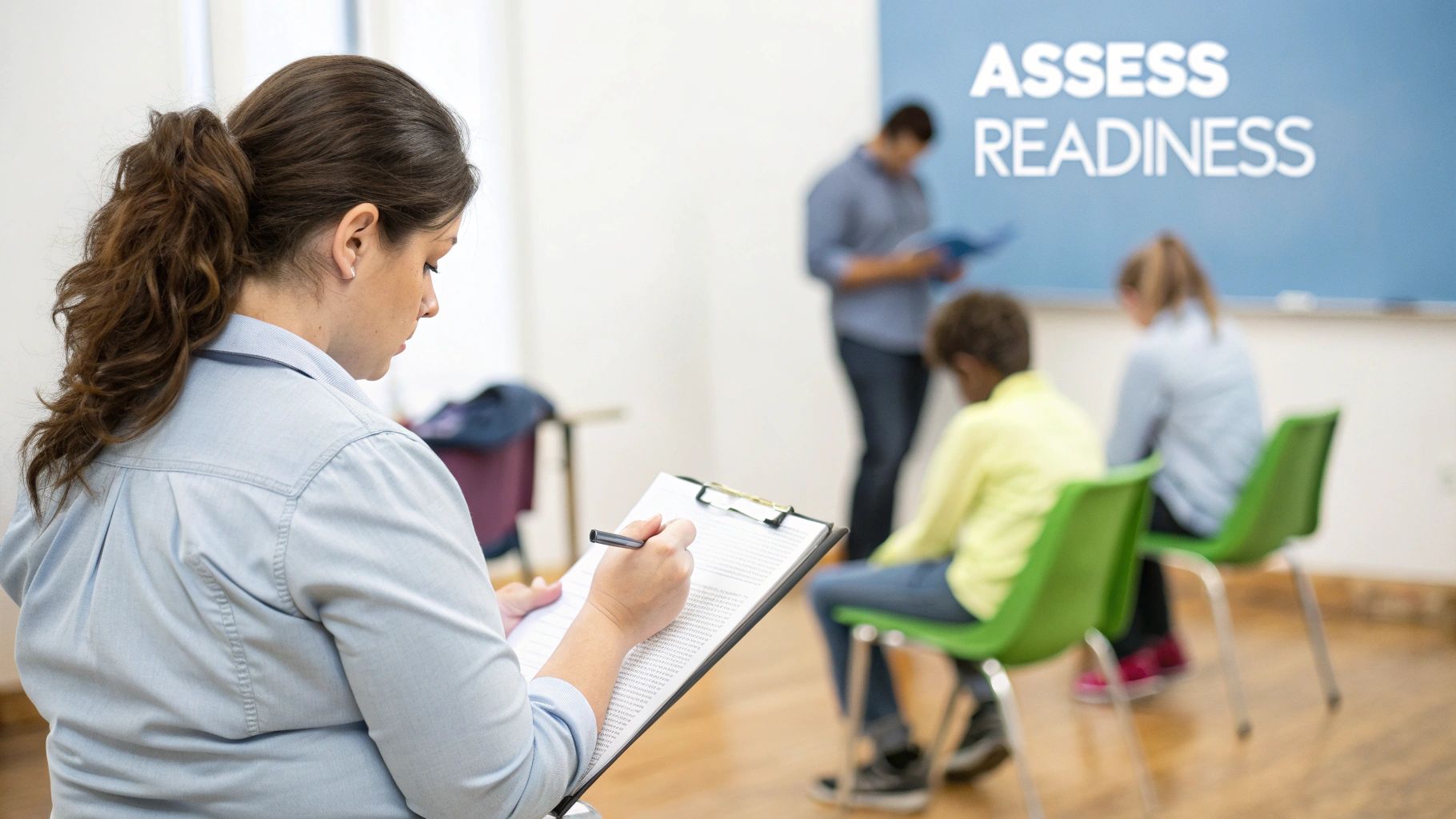 Woman with a ponytail writes on a clipboard while others attend a readiness assessment class.
