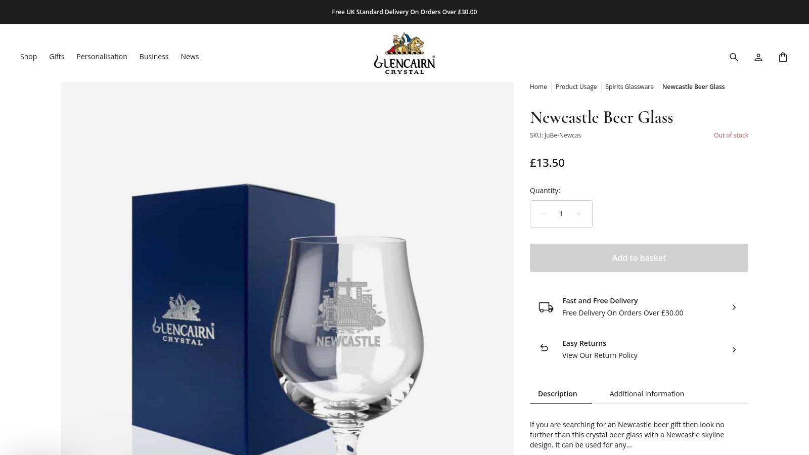 An etched crystal beer tumbler showcasing the Newcastle skyline, including the Tyne Bridge, set against a plain background.