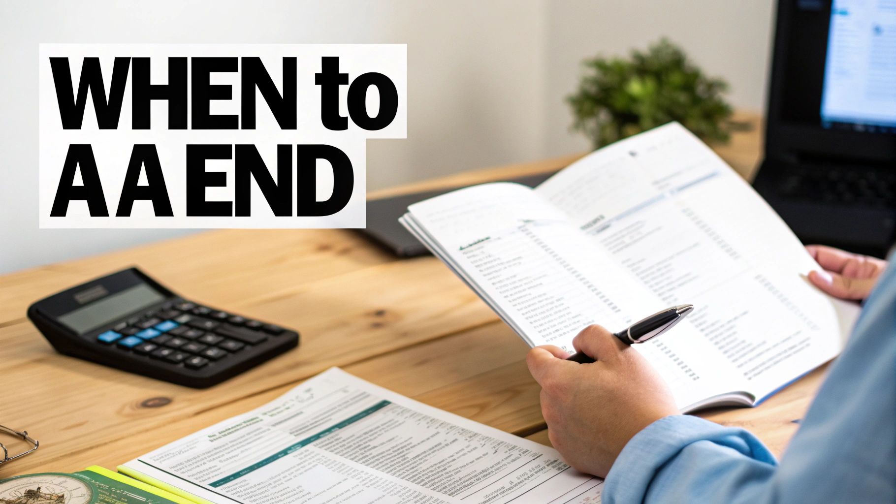 A person reviewing financial documents and calculations on a desk with a calculator and laptop.