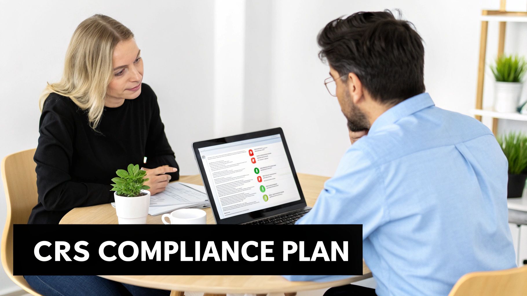 Two professionals, a man and a woman, discuss a CRS compliance plan using a laptop.