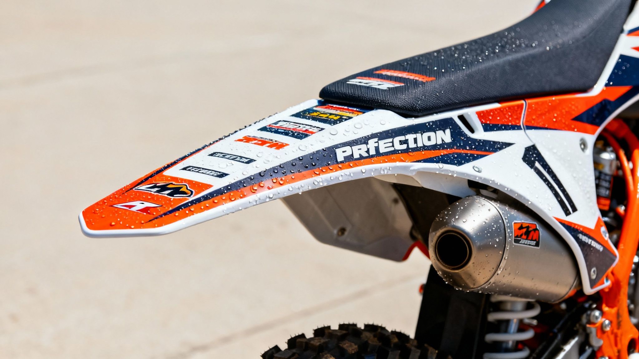 A motocross rider in action, showcasing a vibrant and durable moto sticker kit on their bike.