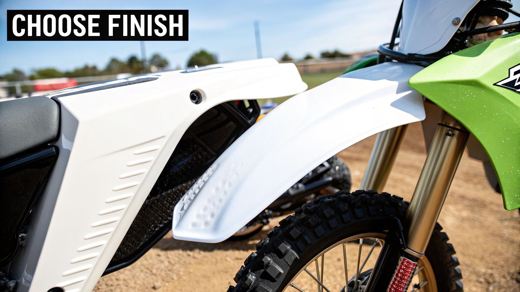 A close-up of a high-quality dirt bike graphic, showing its texture and protective laminate.