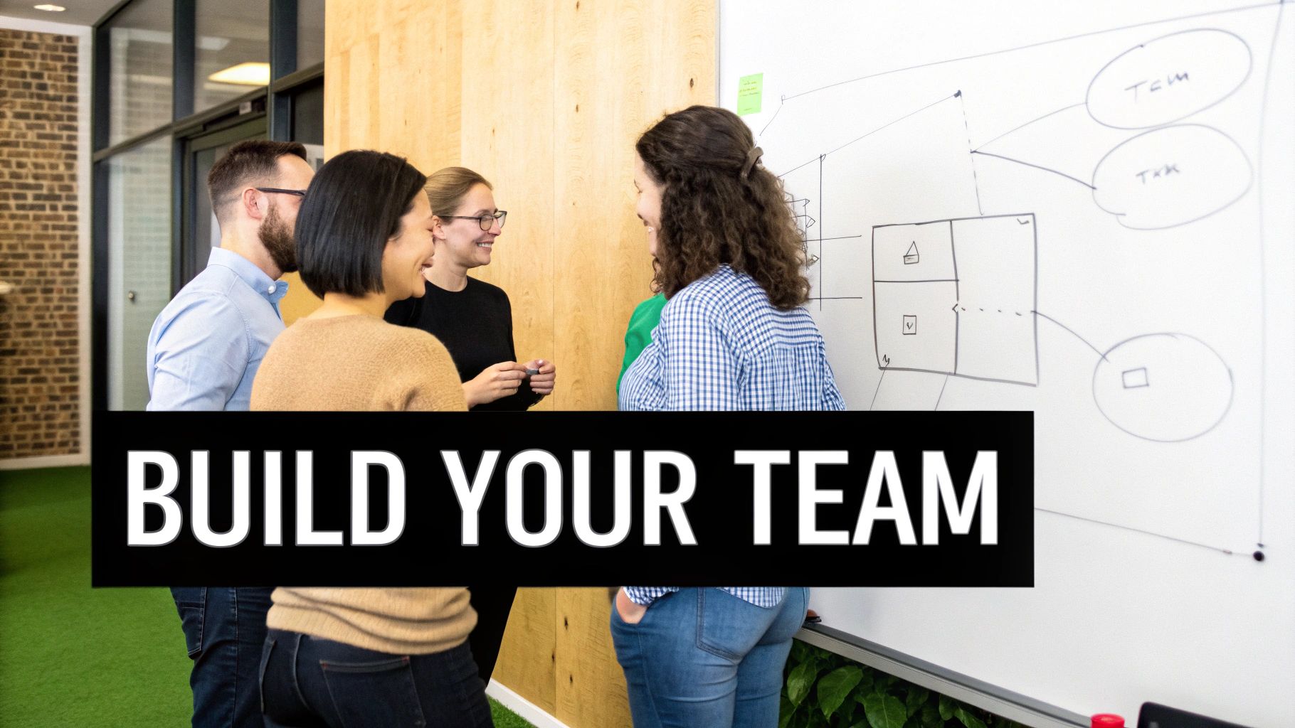 Four diverse colleagues collaborate and discuss ideas in front of a whiteboard, emphasizing teamwork.