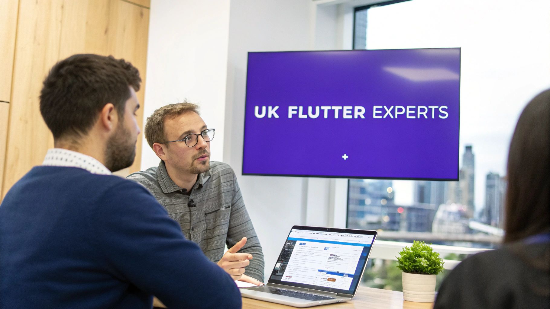 A team of UK-based Flutter developers collaborating on an app project.