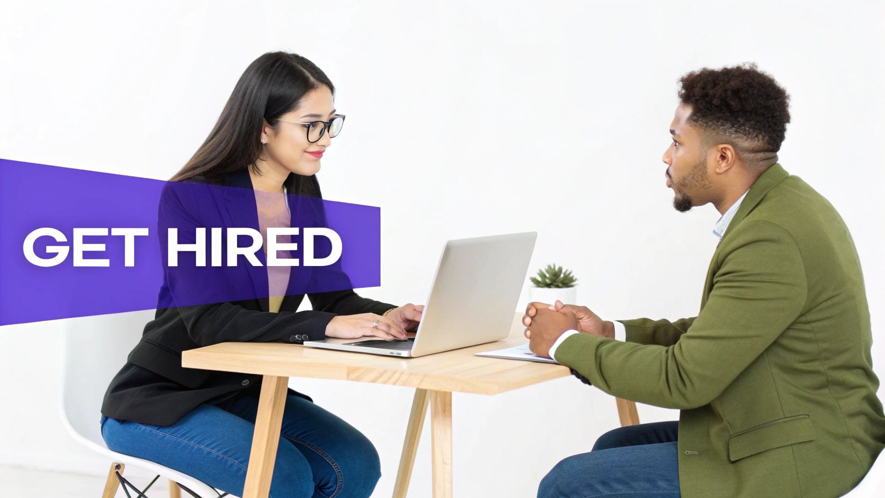 Two individuals conducting a professional interview with a laptop and 'GET HIRED' text.