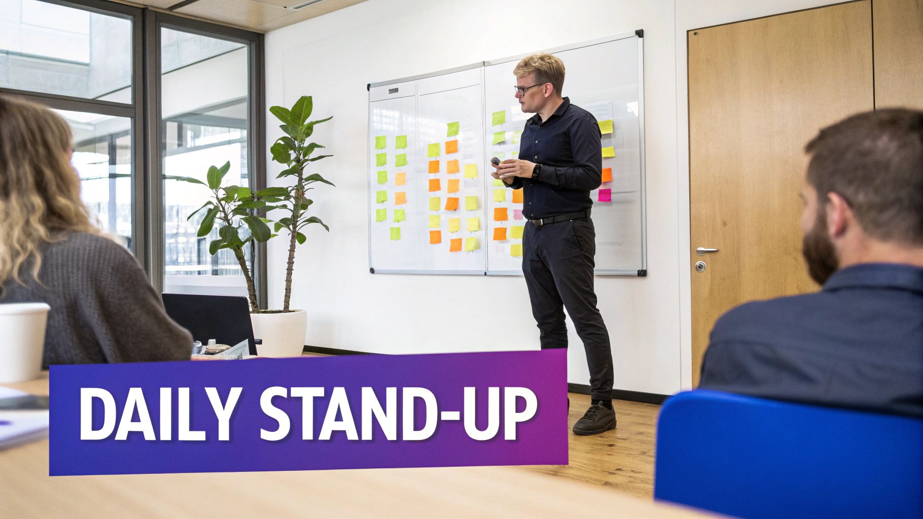 A person at a whiteboard facilitating a discussion with a team, symbolizing the Scrum Master's role in guiding Scrum events.
