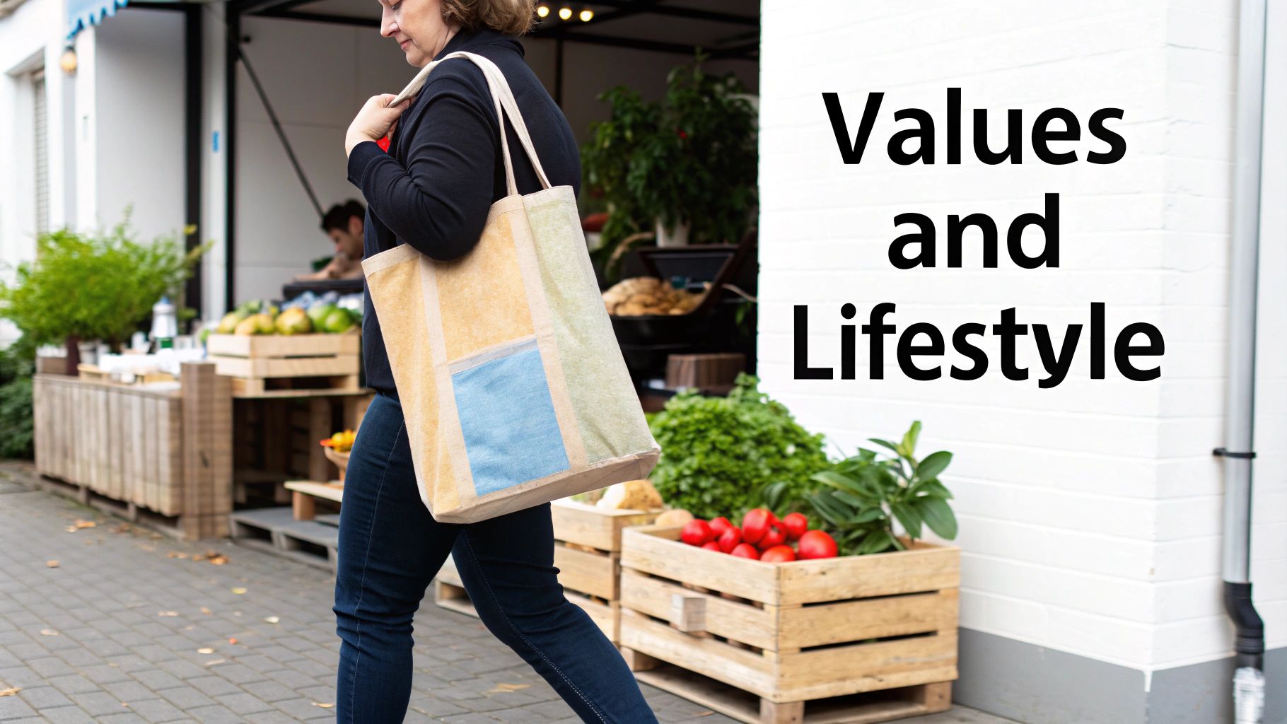 A woman carrying a reusable tote bag walks past an outdoor market with fresh produce.