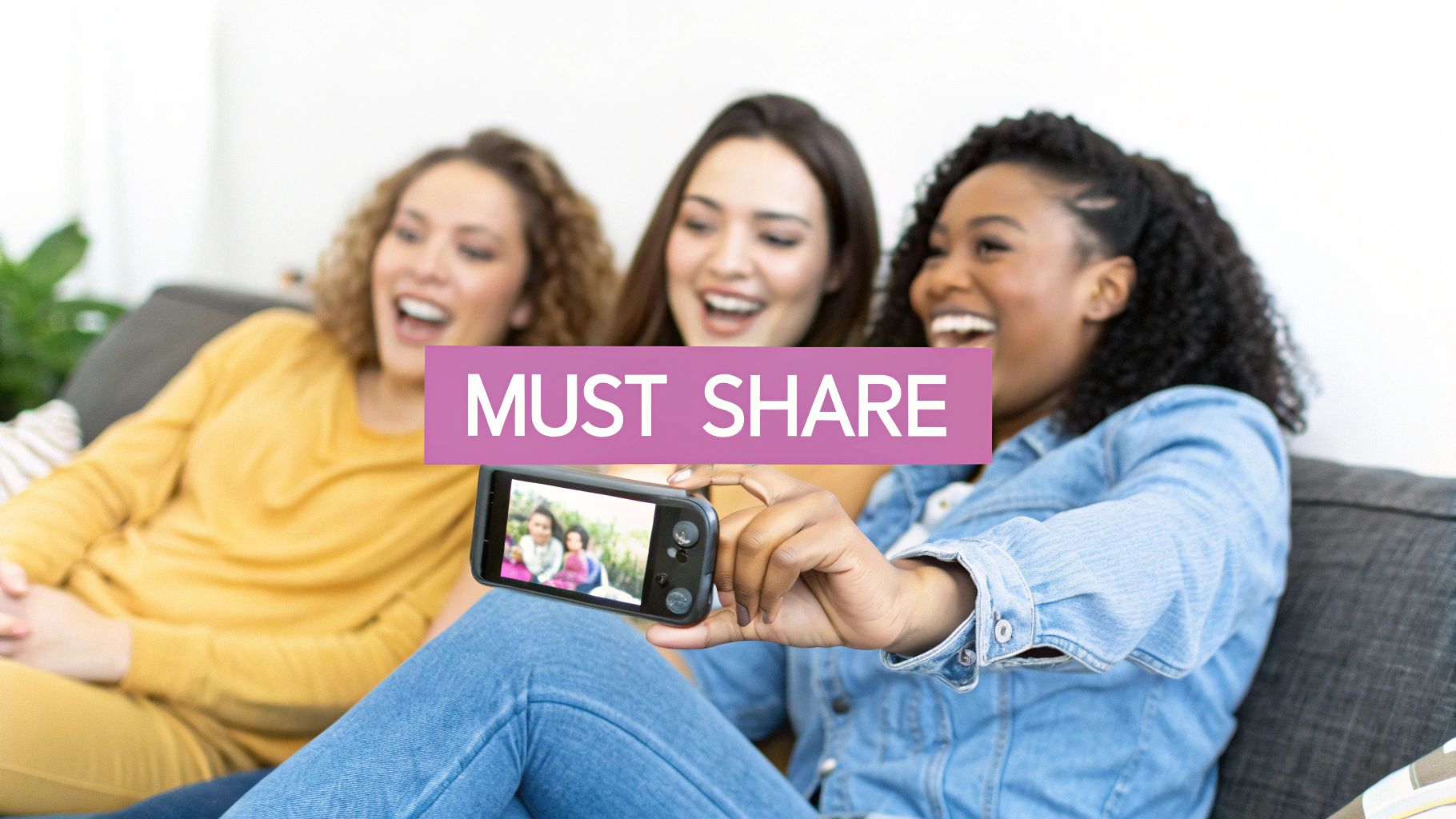 Three joyful women sharing a moment while viewing content on a smartphone, with a 'MUST SHARE' overlay.