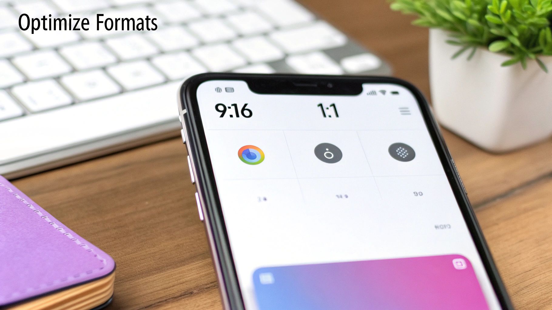 Close-up of a smartphone screen displaying video format optimization options, 9:16 and 1:1, on a wooden desk.