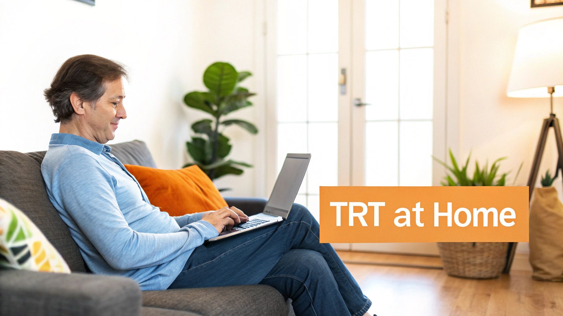 Man on couch using laptop at home with 'TRT at Home' banner for testosterone replacement therapy.