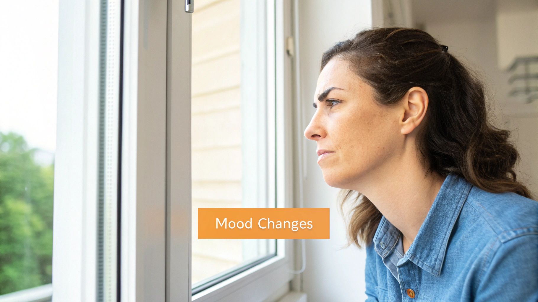A woman looking stressed and unfocused, illustrating mental fog and mood issues.