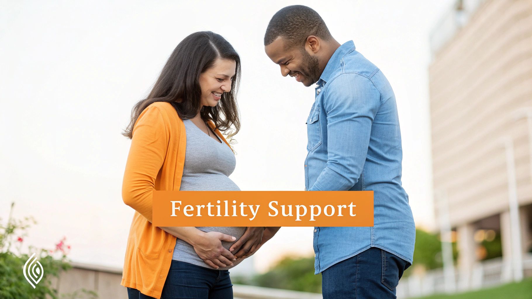 A pregnant woman gently holding her belly