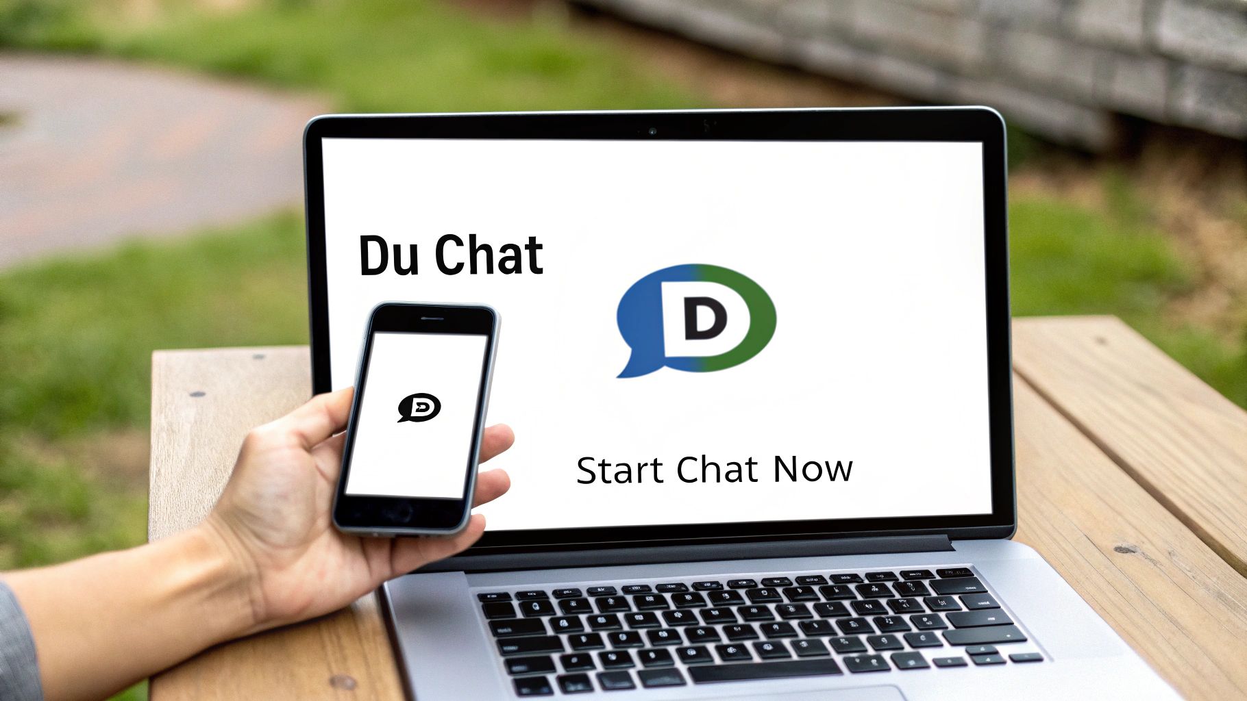 A hand holding a smartphone and a laptop both displaying the Du Chat application interface.