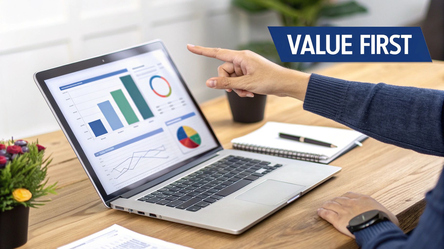 Person pointing at a laptop screen showing business charts and data analysis on a wooden desk.