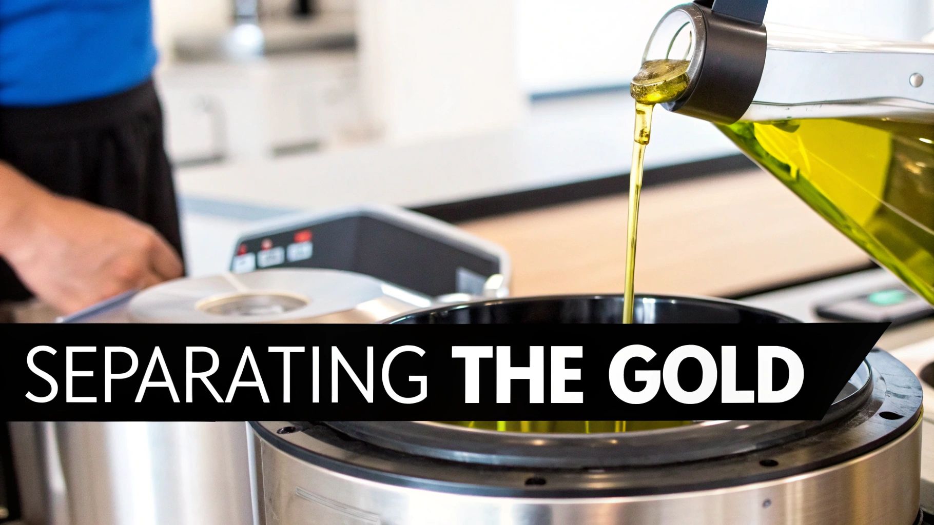Golden olive oil being poured from a clear bottle into a black kitchen appliance or pot.