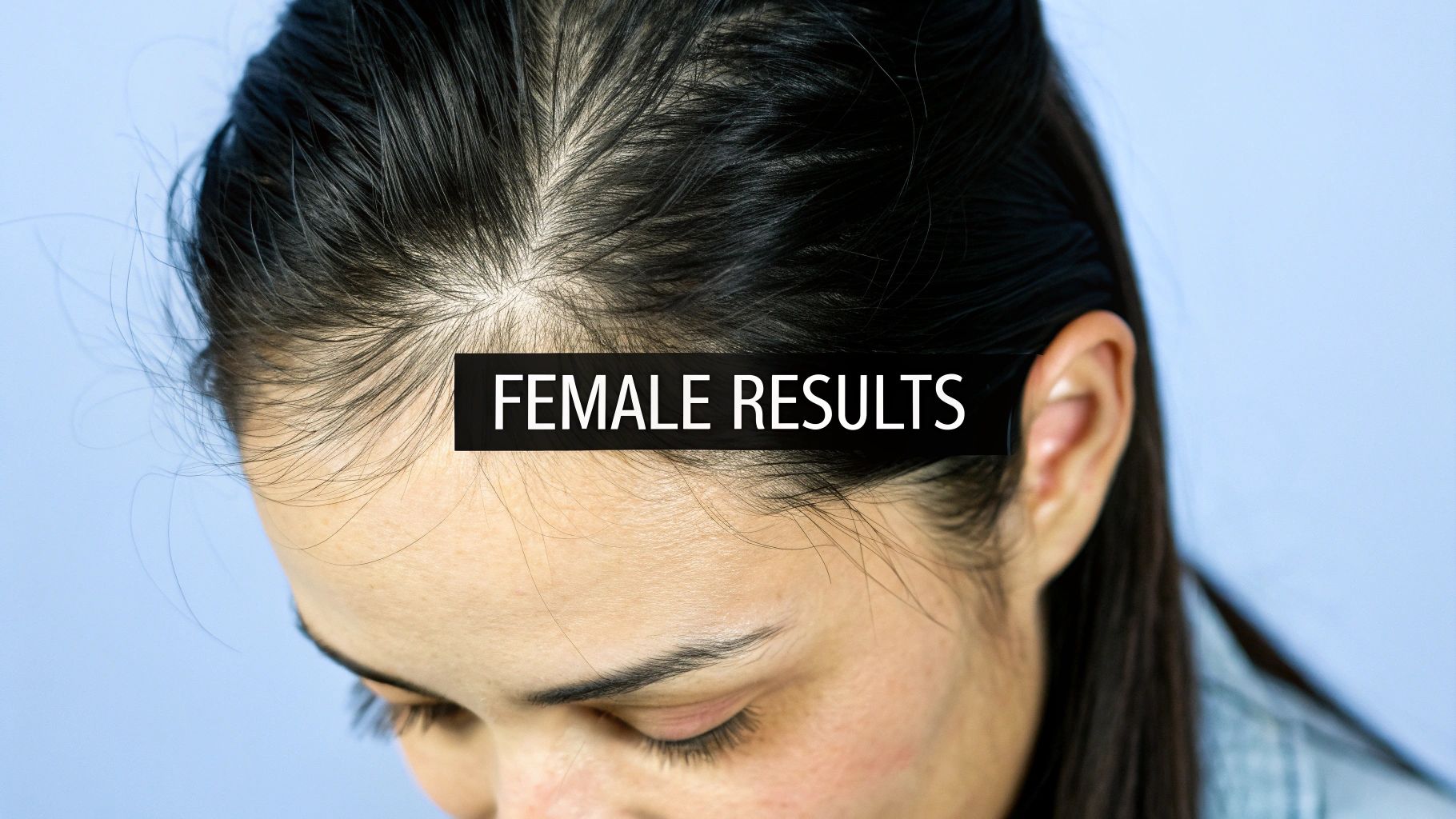 Woman examining her hair in the mirror