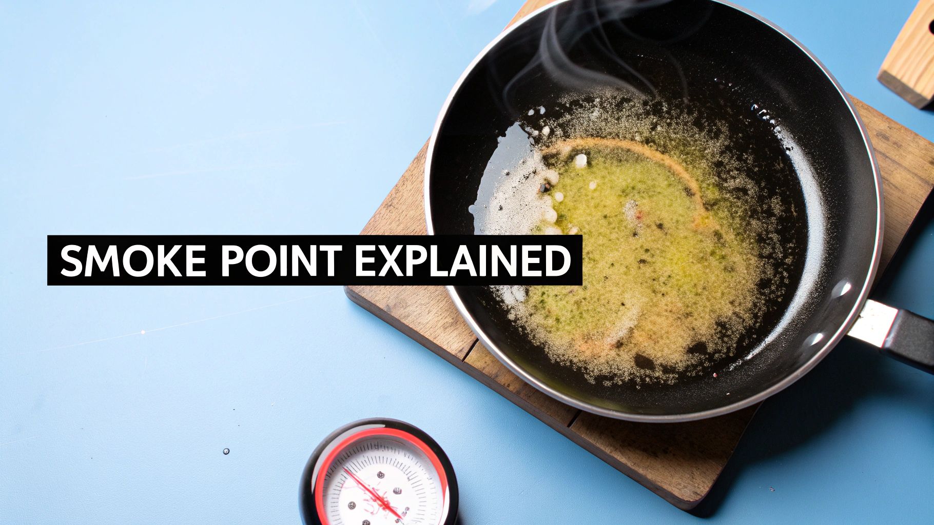 A smoking frying pan with hot oil on a wooden board, illustrating a smoke point concept.