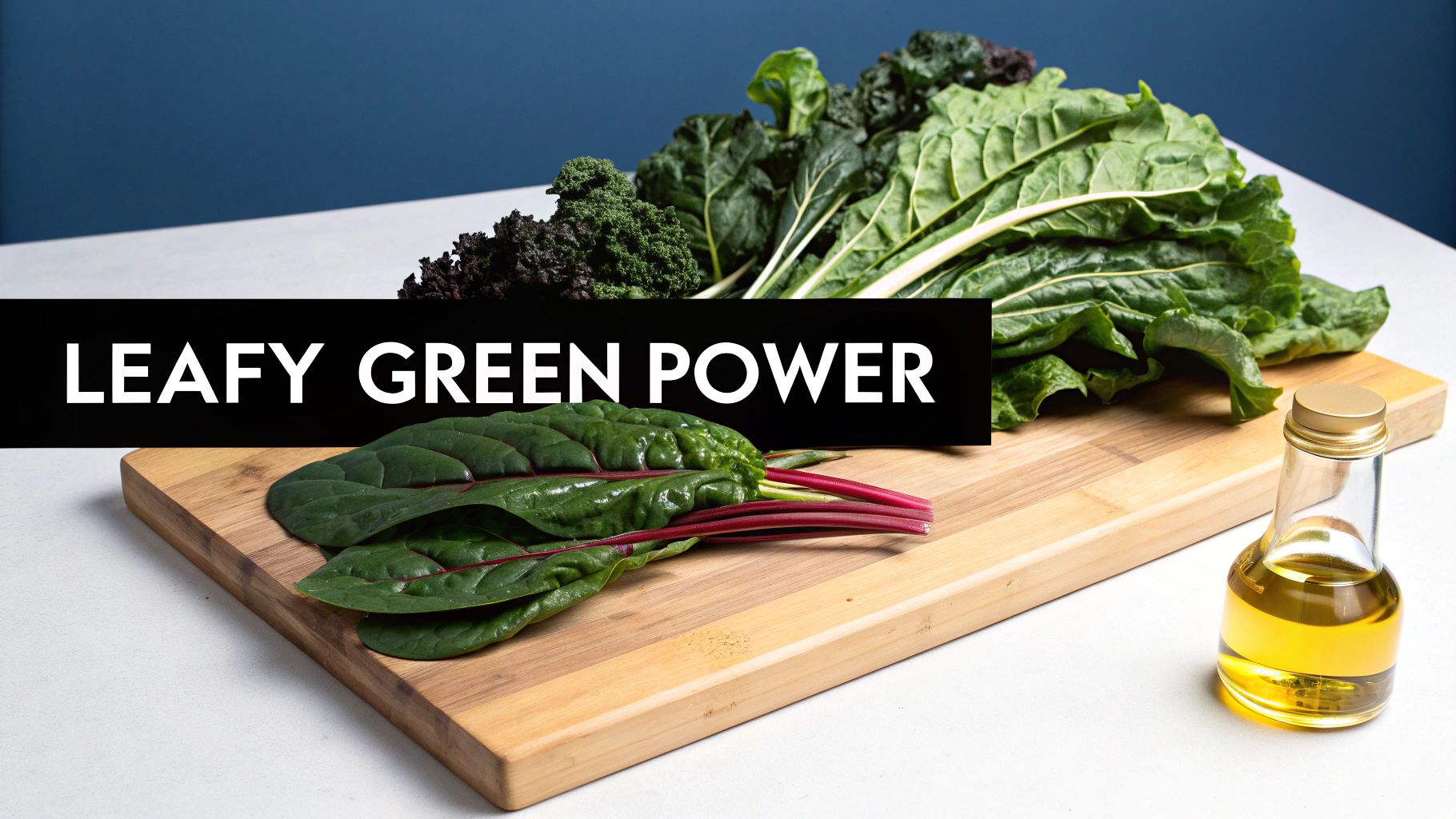 Fresh leafy greens, including kale and chard, on a wooden cutting board with a bottle of oil.