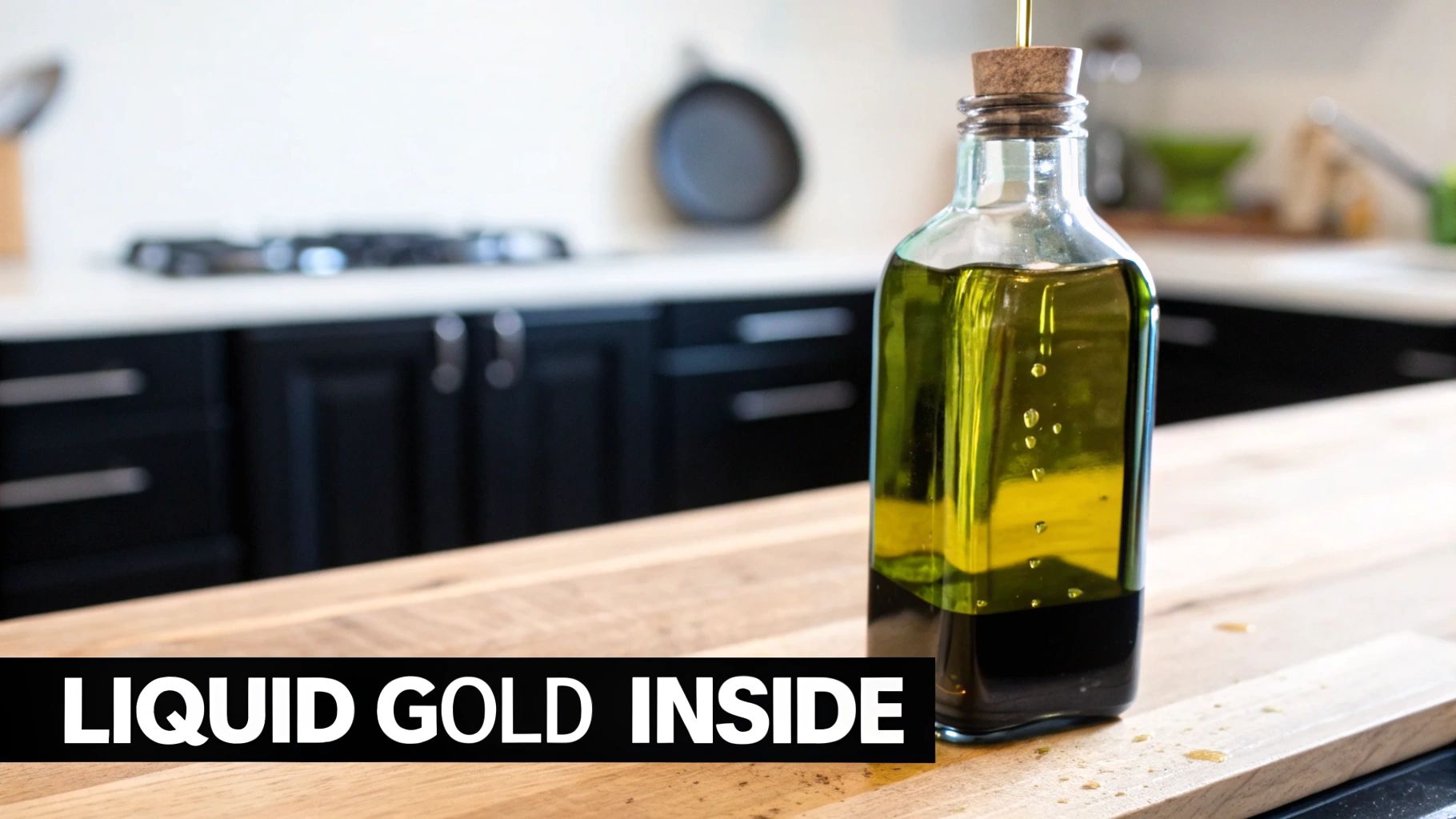 Glass bottle of golden olive oil with cork stopper on wooden cutting board in modern kitchen