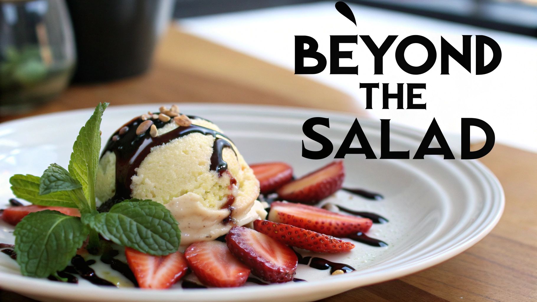 A gourmet dessert plate featuring ice cream, chocolate syrup, fresh strawberries, mint, and nuts.