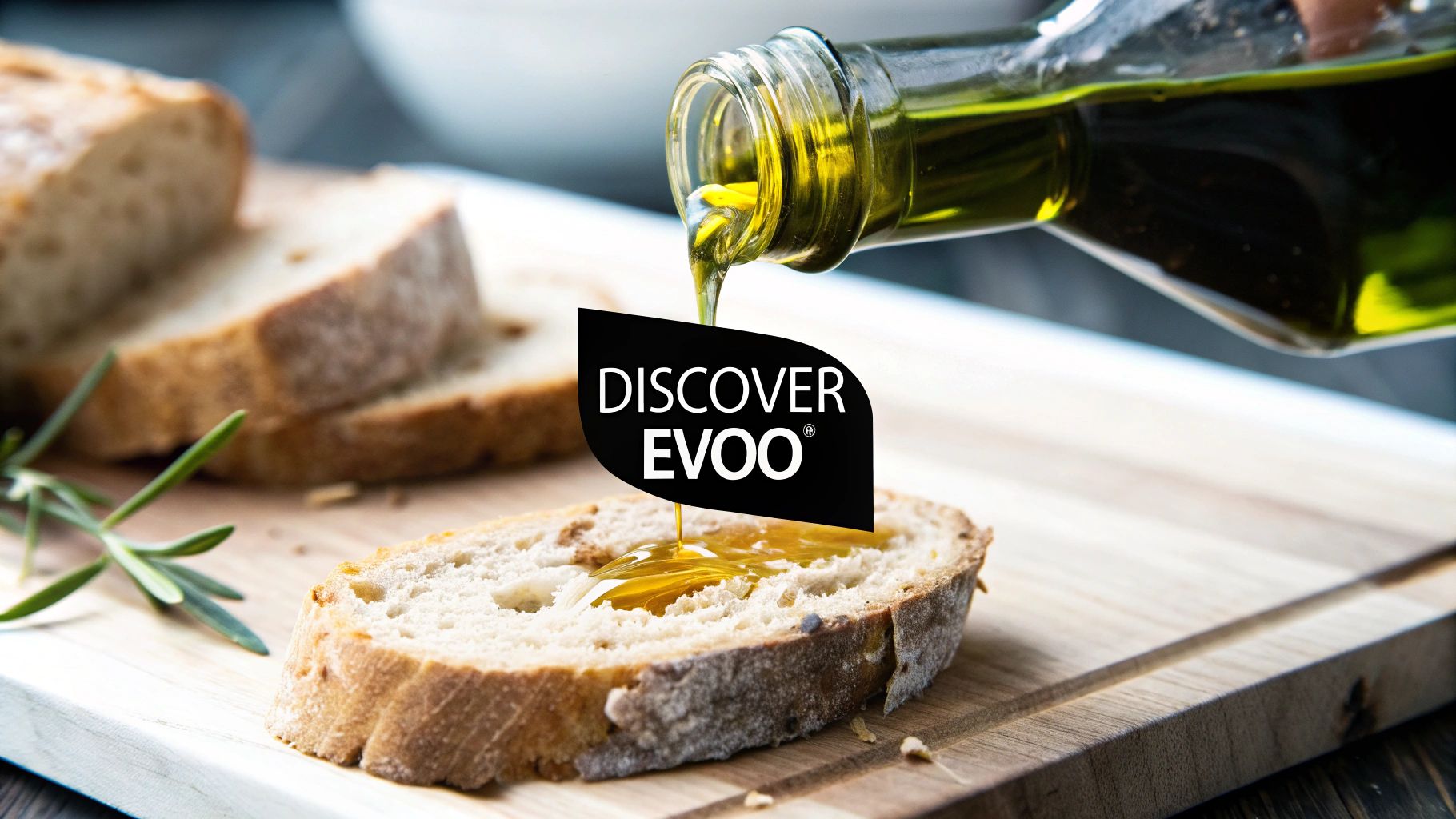 Close-up of extra virgin olive oil being poured onto fresh bread on a wooden board.