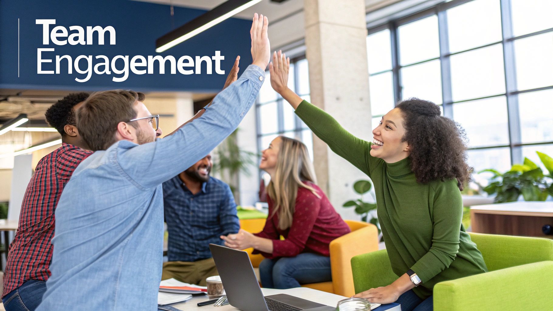 A diverse team in a bright, modern office having an engaged and positive discussion around a table, illustrating a culture of psychological safety.