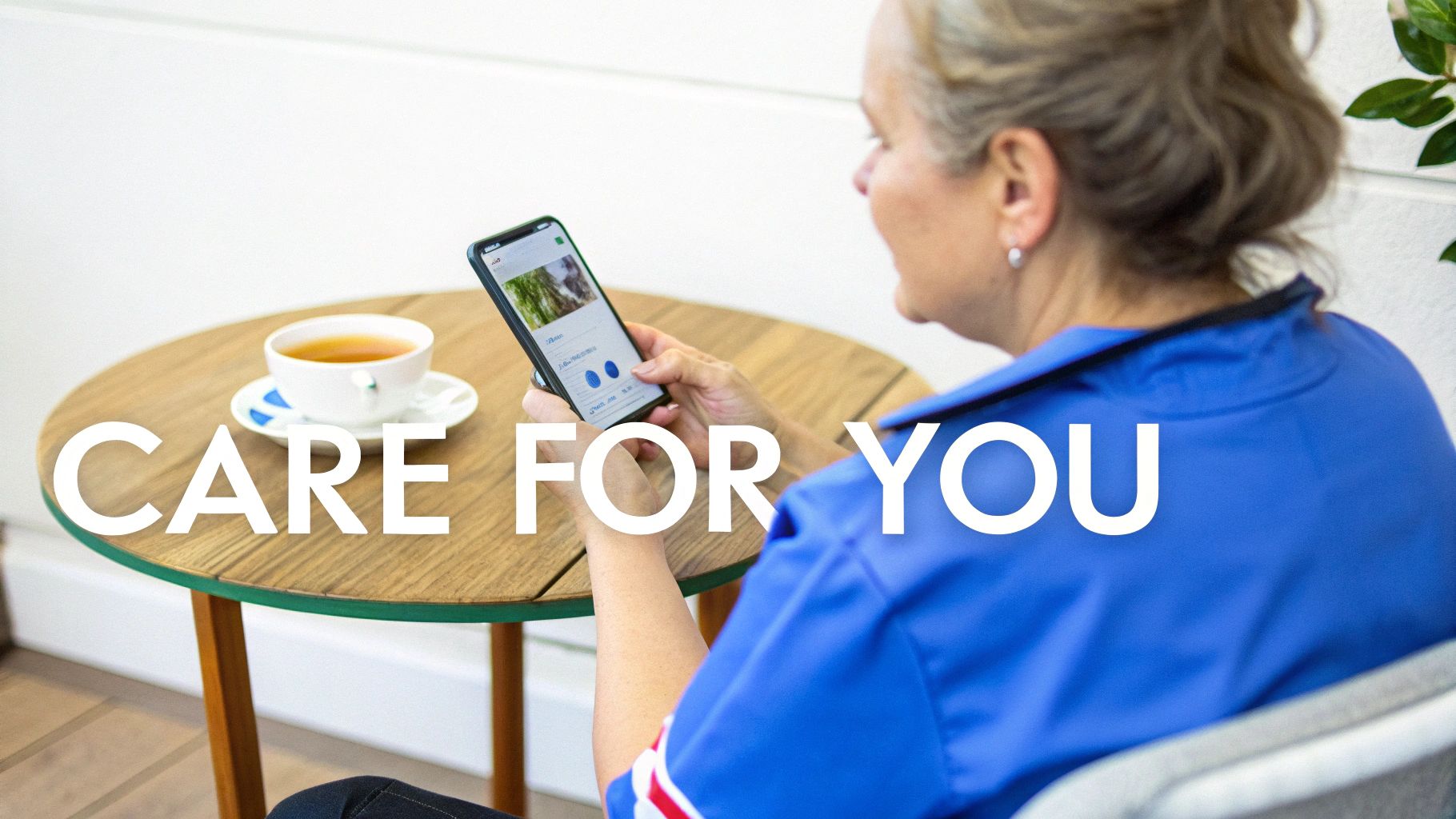 A caregiver sitting on a sofa, looking thoughtful and taking a moment for themselves.