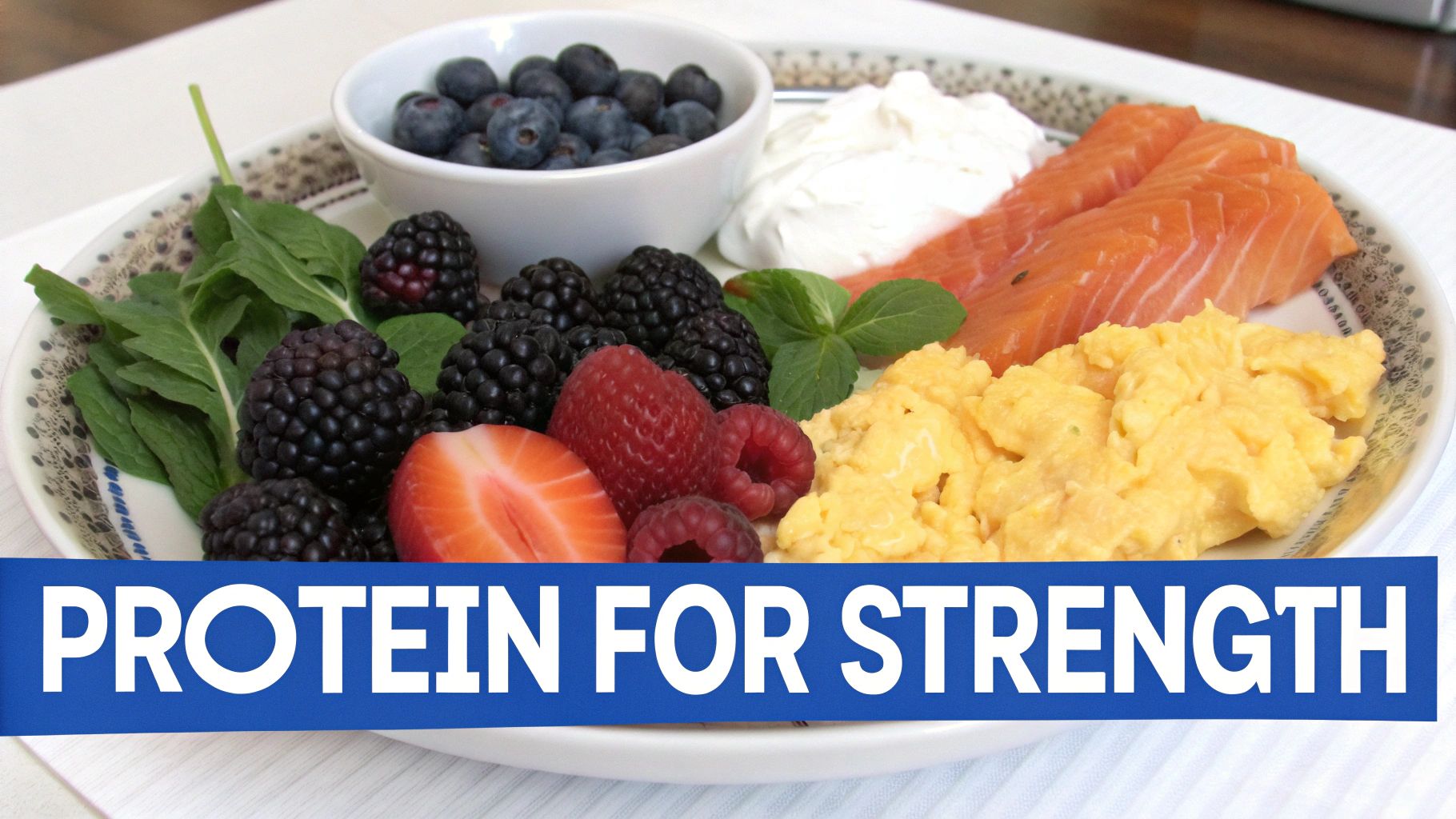 A plate of salmon, scrambled eggs, blueberries, raspberries, and blackberries, promoting protein for strength.
