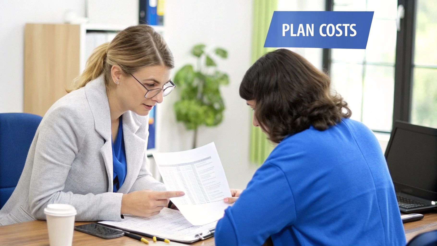 A caring nurse explains Medicare plan details to a senior couple in their home.