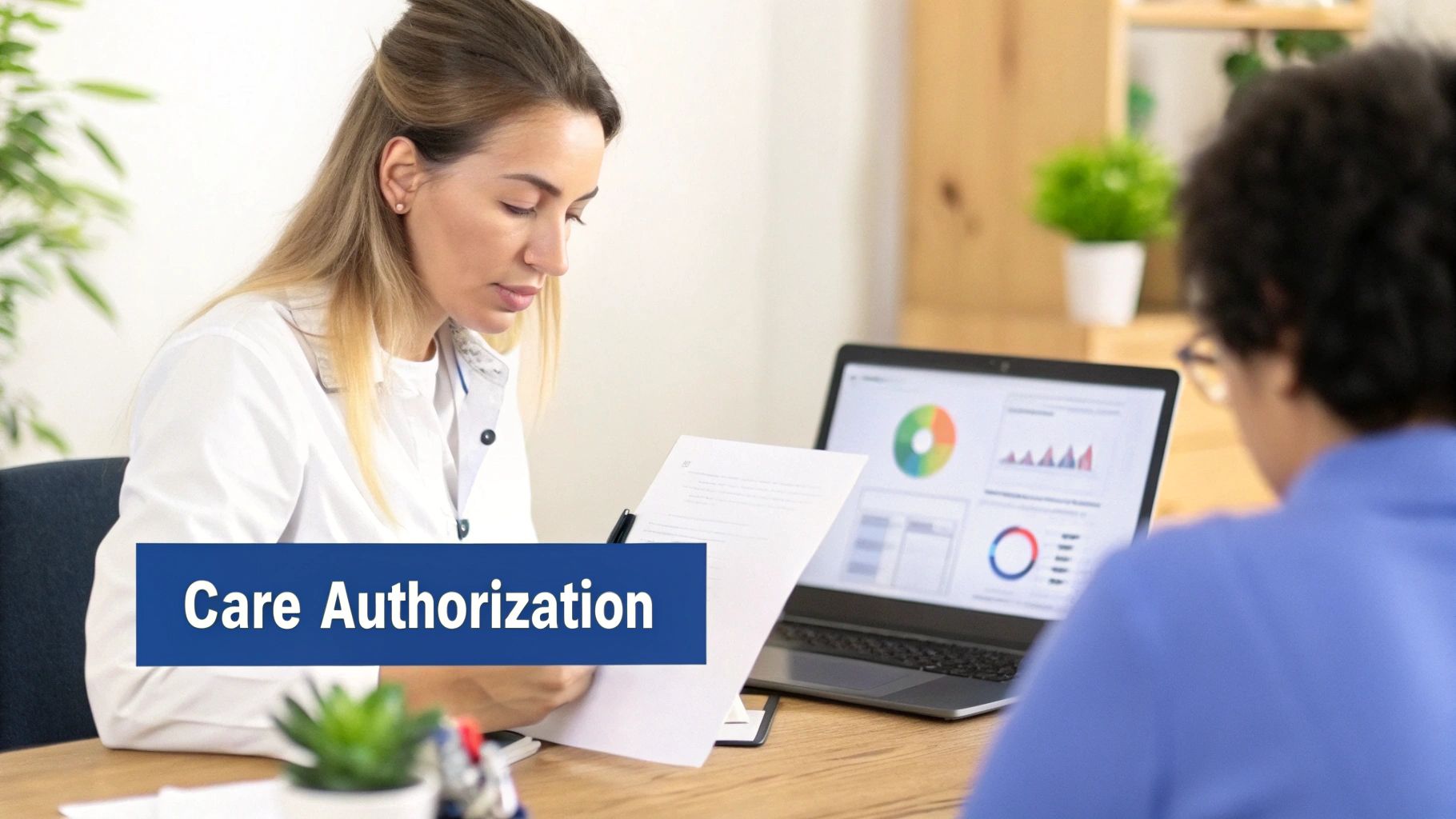 Healthcare professional reviews care authorization documents while a patient or colleague uses a laptop with data.