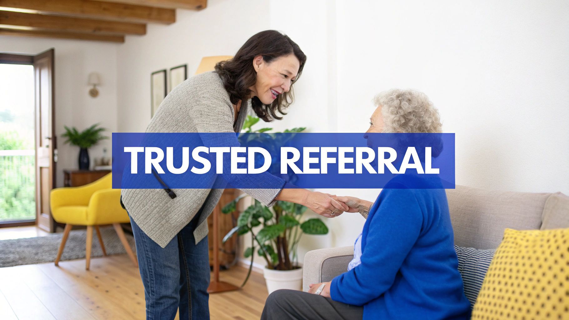 A smiling woman shakes hands with an older woman, symbolizing a trusted referral.