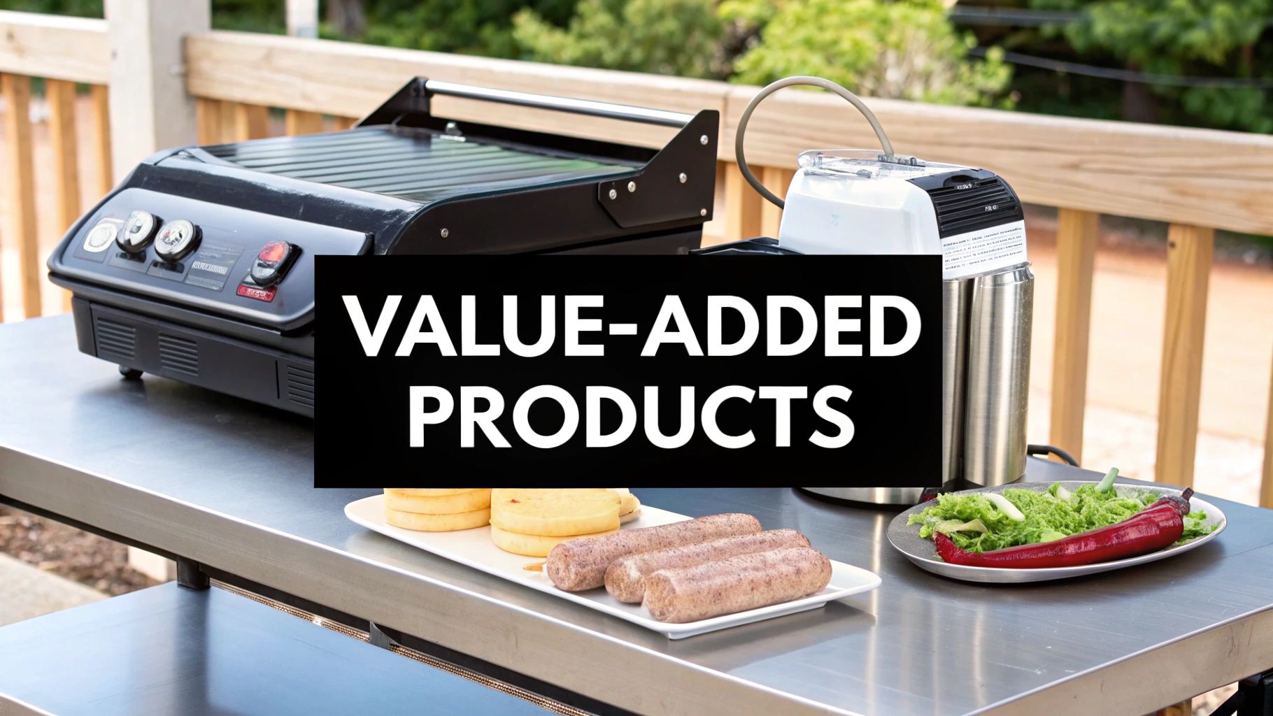 Outdoor cooking and food prep station with a grill, vacuum sealer, sausages, and fresh vegetables.