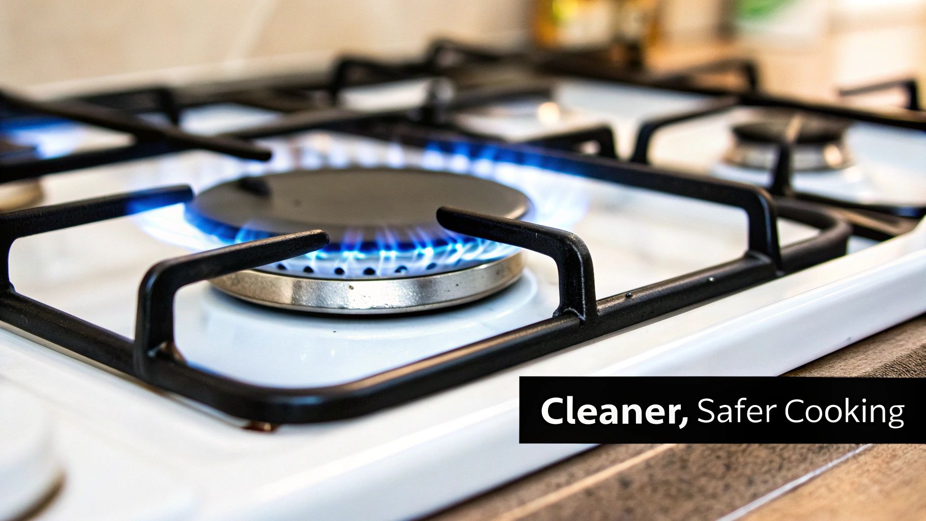 Gas stove burner with blue flame burning on white cooktop promoting cleaner safer cooking