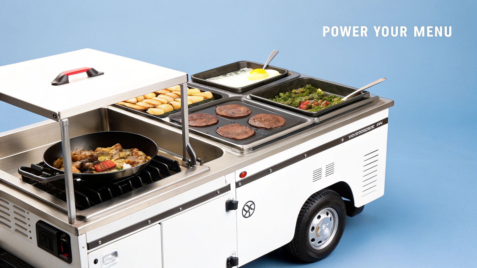A mobile food truck kitchen with multiple cooking stations, including a stove, griddle, and warming trays.