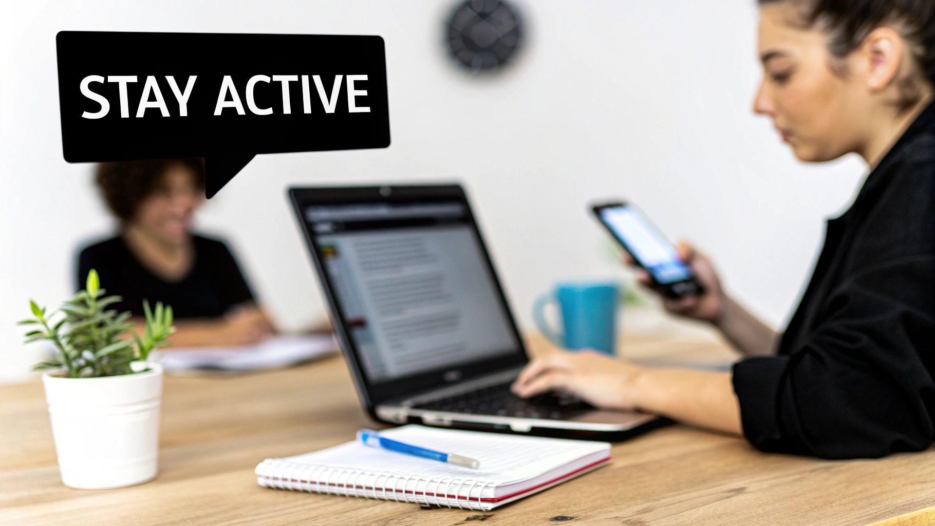 A restaurant equipment supplier responding to customer reviews on a laptop in a modern office.