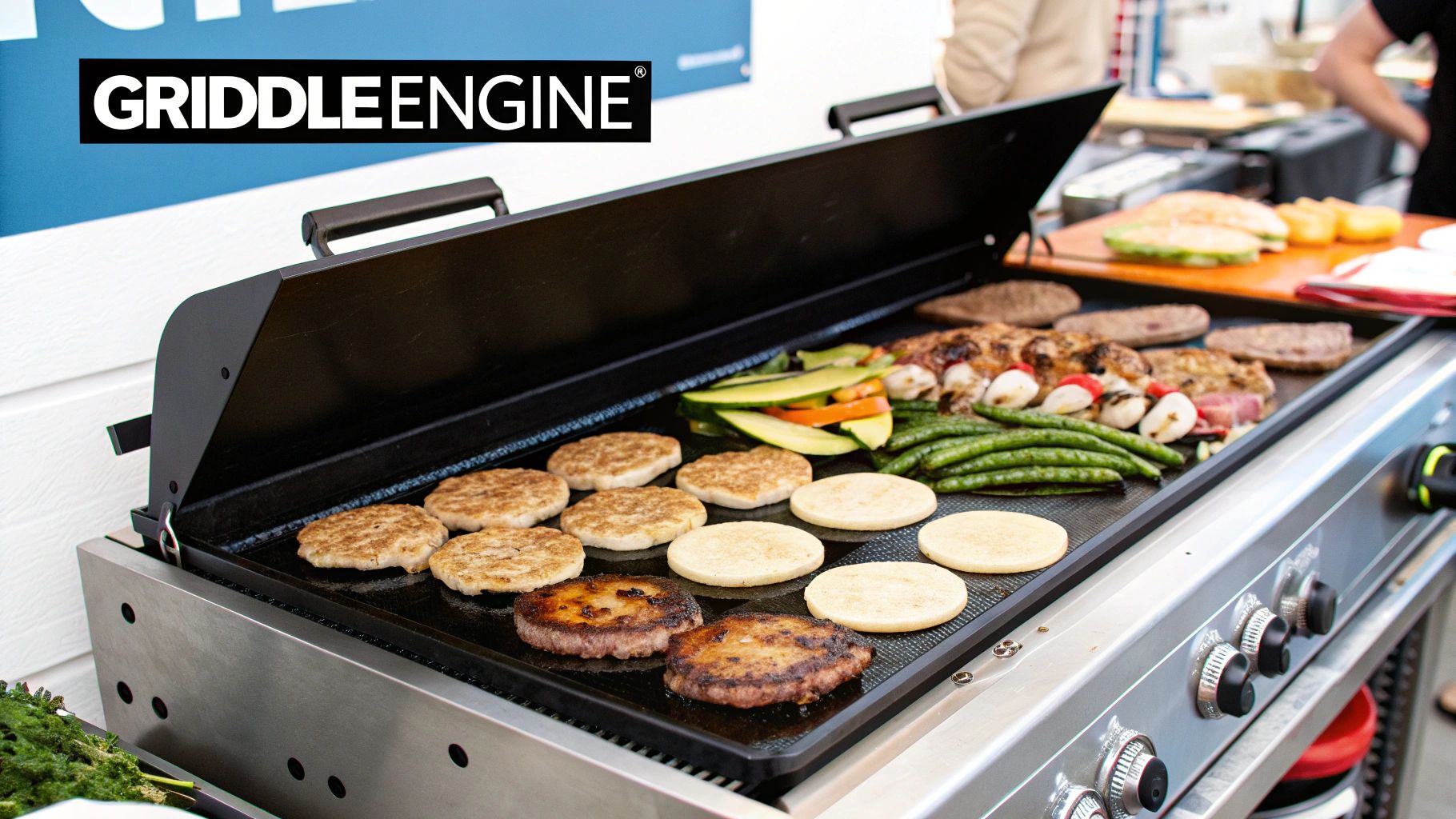 A chef using a commercial griddle to cook burgers
