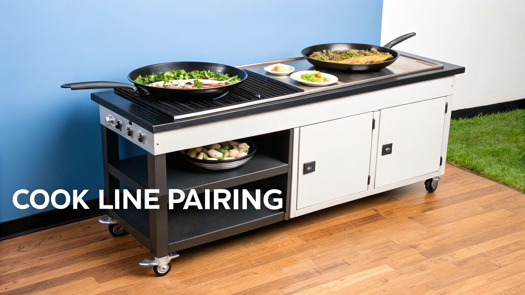 A mobile cooking station with two large pans preparing food, featuring ingredients on a lower shelf.